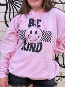 BE KIND (front): DEAR PERSON BEHIND ME (back), pink hoodie with black graphic