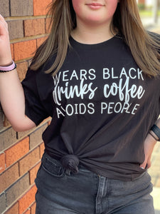 WEARS BLACK, DRINKS COFFEE, AVOIDS PEOPLE